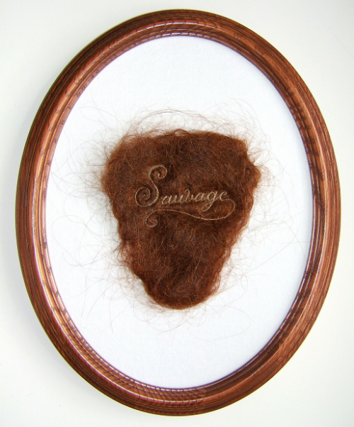 "Sauvage", 2013, human hair embroidery on hair, velvet, 7 x 4" piece, 12 x 9" framed. Image via Kate Kretz